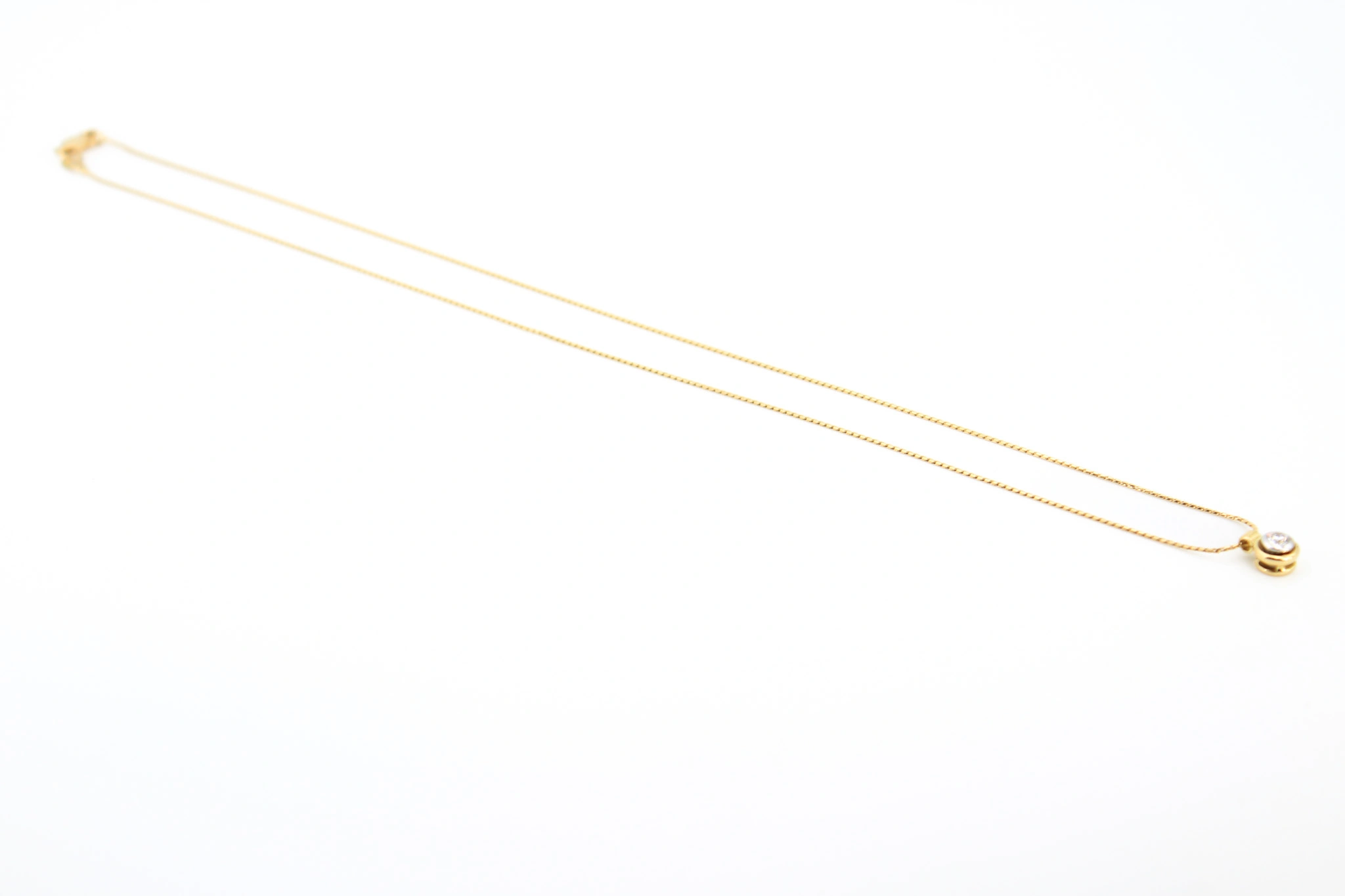 Cadena de oro 18K con colgante bicolor y circonita