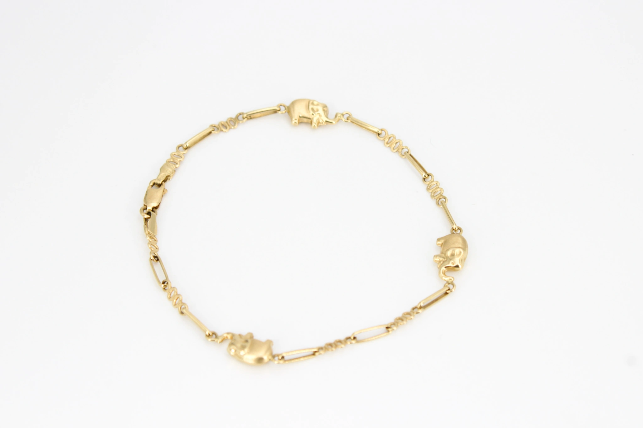 Pulsera de oro 18K con motivos de elefantes