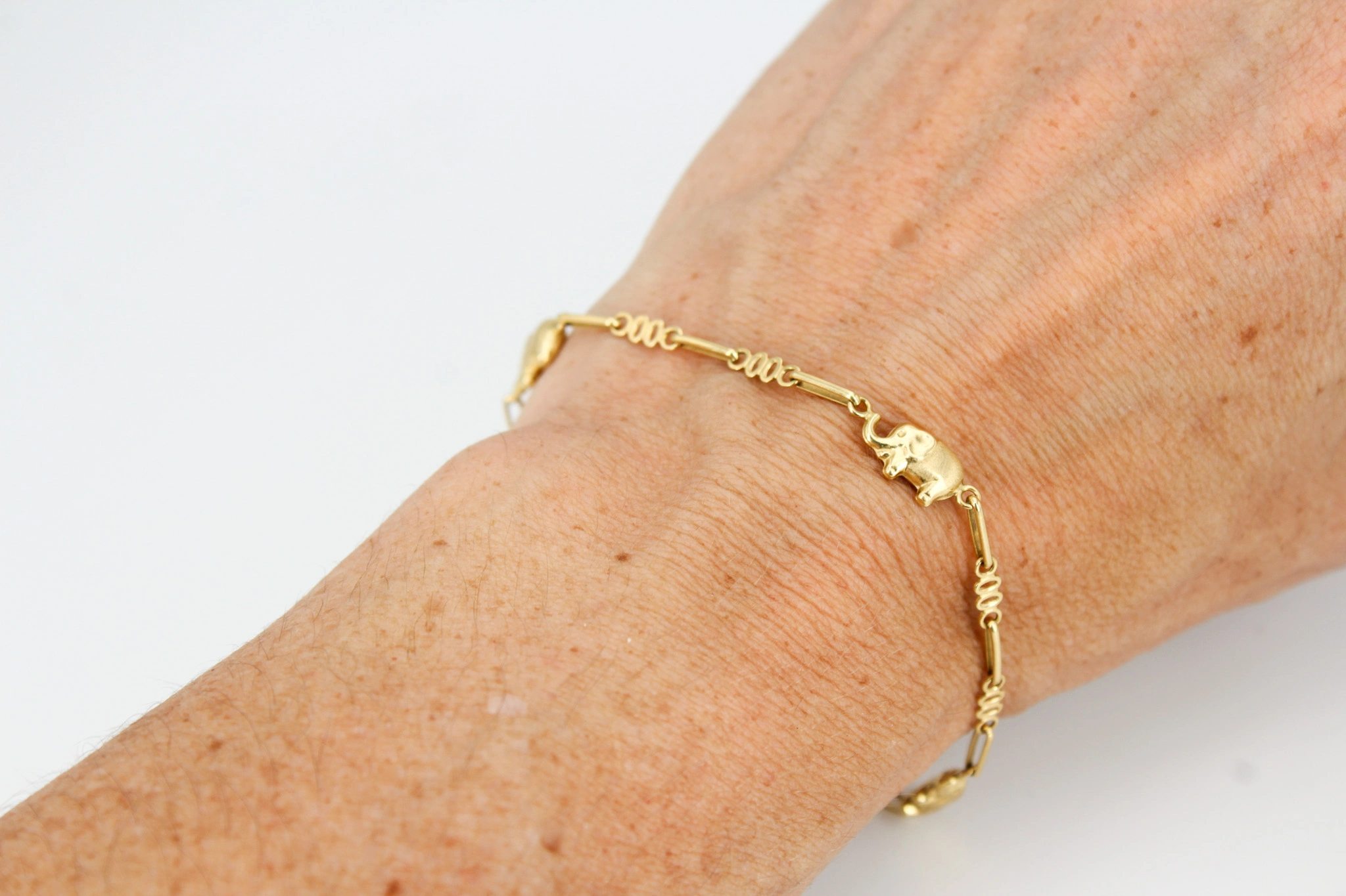 Pulsera de oro 18K con motivos de elefantes — foto 3