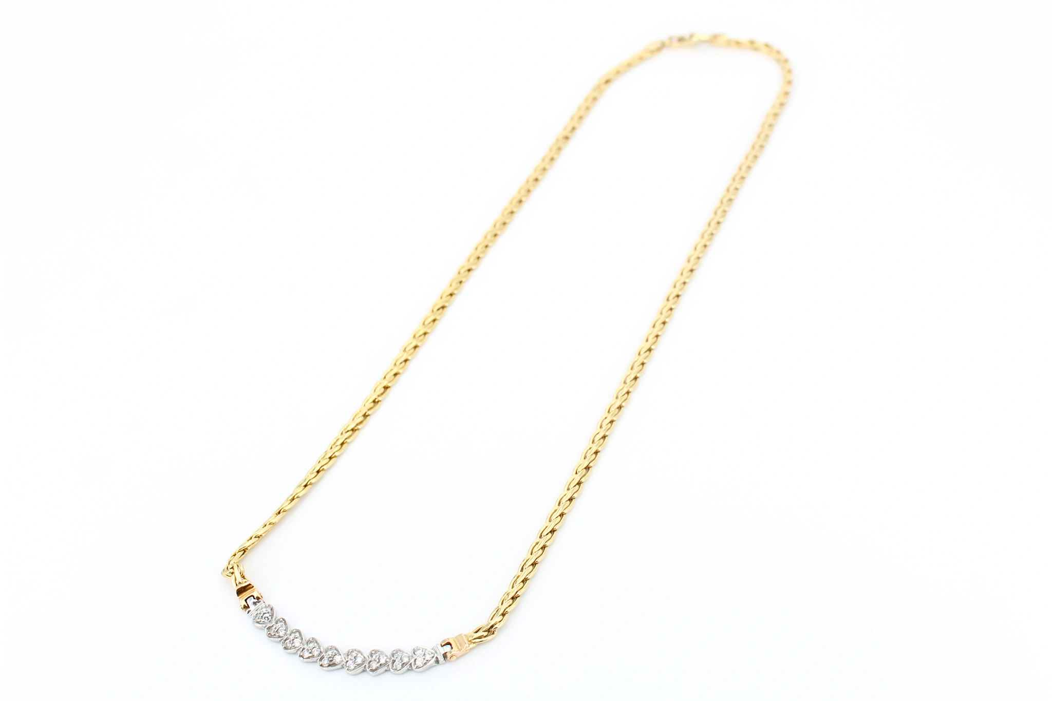 Gargantilla de oro 18K con motivos de corazón y circonitas